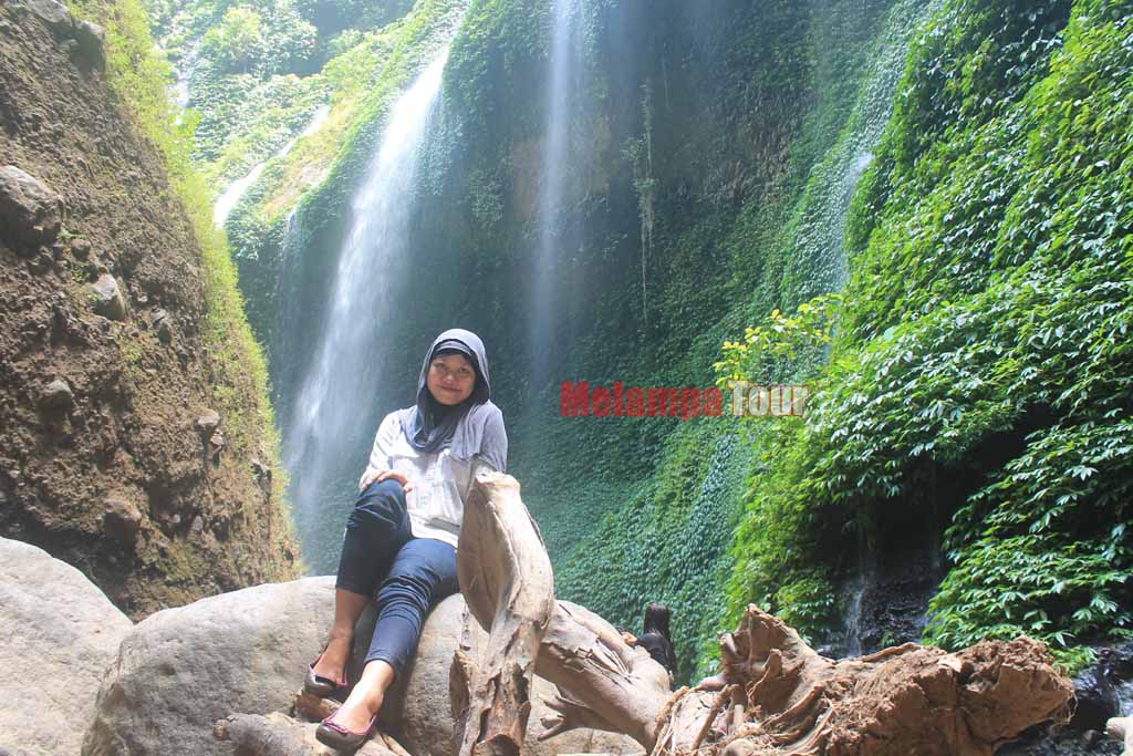 A beautiful girl photo and Madakaripura waterfall