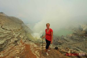 A girl and Ijen crater background view