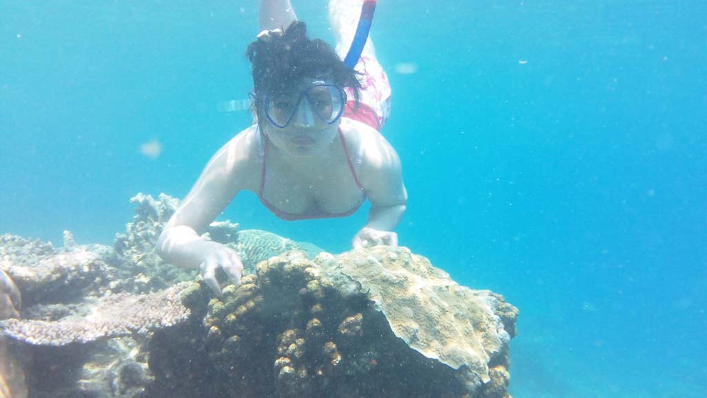 A girl is doing snorkeling in Tidung island