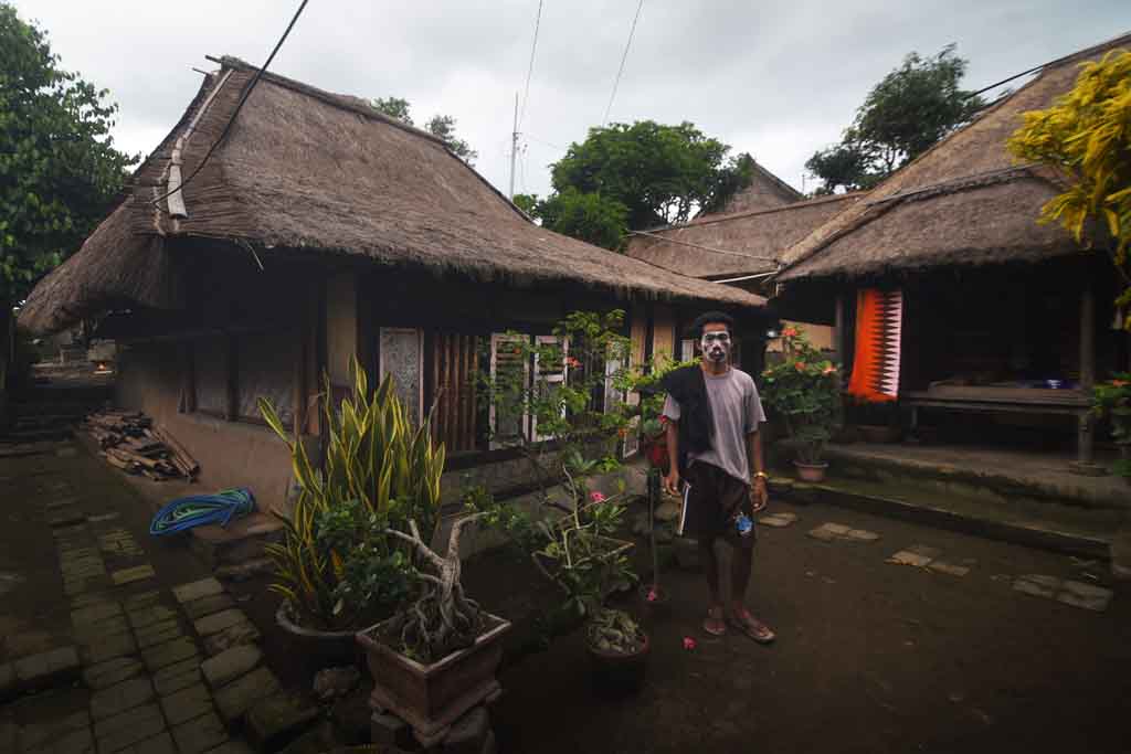 A people of Sasak in front of his house