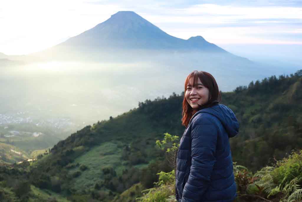 A beautiful girl enjoying the landscape of Dieng plateau